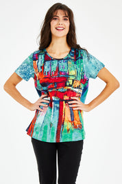 Model Courtney wearing size 10 of the Boats Organic Cotton Tee in colour Boats (Blue), from the front, cropped image