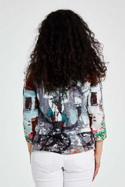 Model Bernadette wearing size 10 of the Tuscany Organic Cotton 3/4 Sleeve Tin colourShirt Contemporary - Tuscany (Blue), from the back