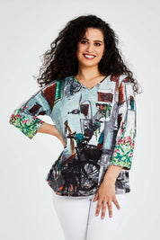 Model Bernadette wearing size 10 of the Tuscany Organic Cotton 3/4 Sleeve Tin colourShirt Contemporary - Tuscany (Blue), from the front, cropped image