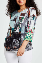 Model Bernadette wearing size 10 of the Tuscany Organic Cotton 3/4 Sleeve Tin colourShirt Contemporary - Tuscany (Blue), from the front, cropped image