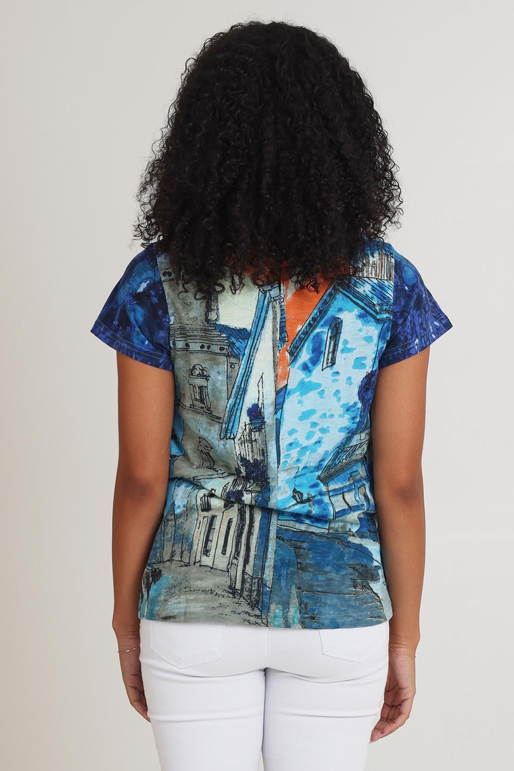 Model Ziara wearing size 10 of the Cotton Crew Contemporary Tin colourShirt - Towerblue, from the back