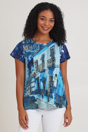 Model Ziara wearing size 10 of the Cotton Crew Contemporary Tin colourShirt - Towerblue, from the front, cropped image