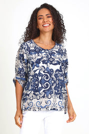Model Pamelar wearing size 10 of the Frill Neckline Top – Print in colour Print, in a cropped view