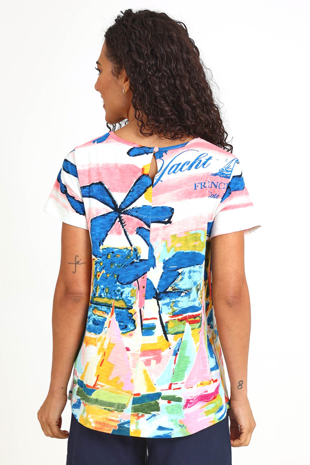Model Pamelar wearing size 10 of the V Contemporary T-Shirt – Yacht in colour Yacht, from the back