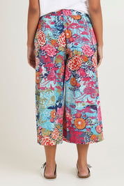 Model Ziara wearing size 10 of the Ikebana Cotton Pant in colour Ikebana, from the back