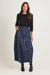 Model Madeline wearing size 10 of the Tabriz Skirt in colour Tabriz (Blue), from the front, showing the whole outfit