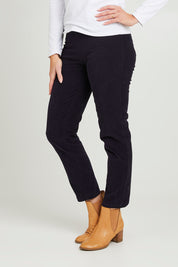 Model Katie wearing size 10 of the Essentials Cord Jeggings in colour Navy (Blue), from the front, cropped image