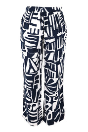 Product shot of the Corduroy Flared Trouser in colour Navy (Blue), from the back
