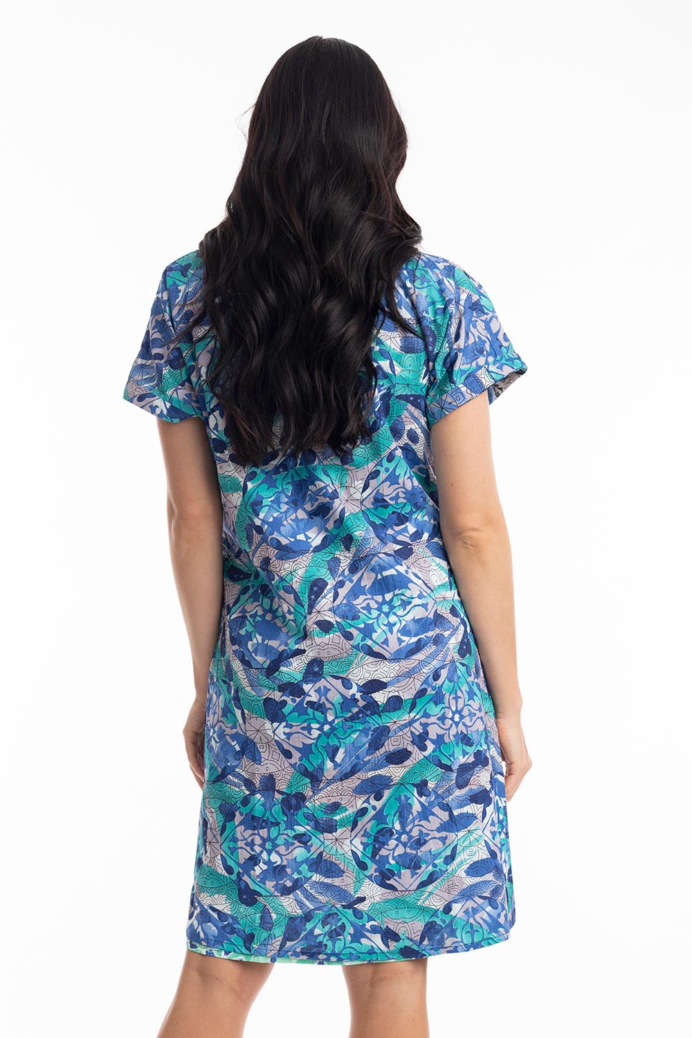 A model wearing the Cayman Organic Cotton Reversible Dress in colour Print (Blue), from the back