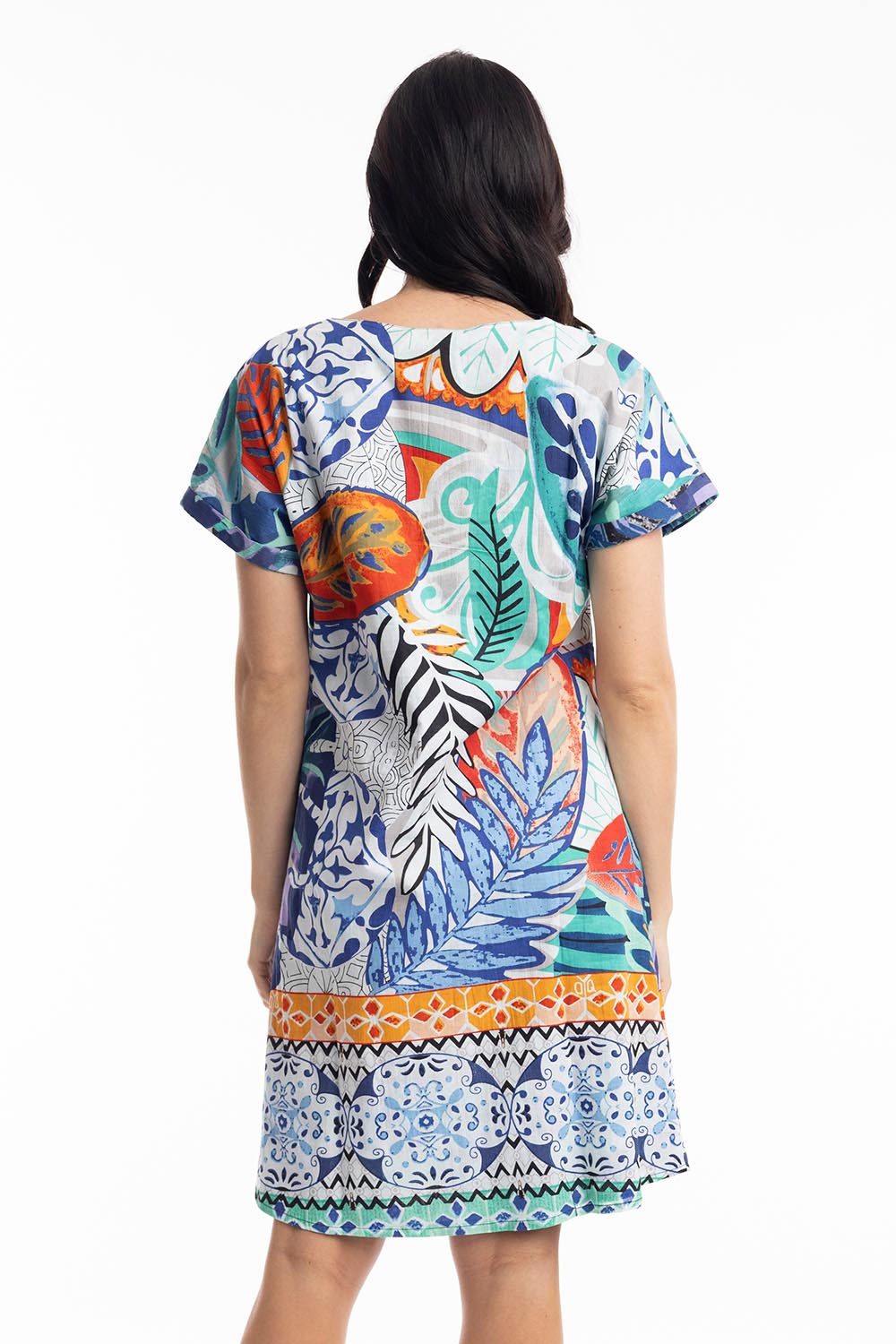 A model wearing the Cayman Organic Cotton Reversible Dress in colour Print (Blue), from the back