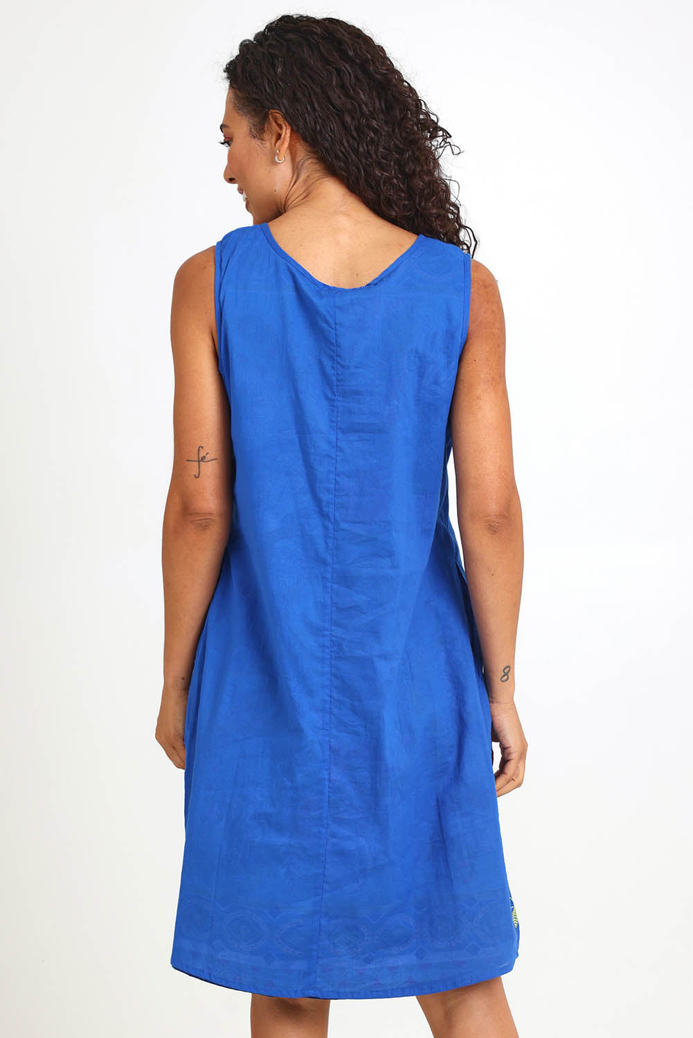 Model Pamelar wearing size 10 of the Sleeveless Reversible Dress – Print in colour Print, from the back