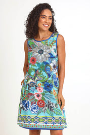 Model Pamelar wearing size 10 of the Sleeveless Reversible Dress – Print in colour Print, in a cropped view