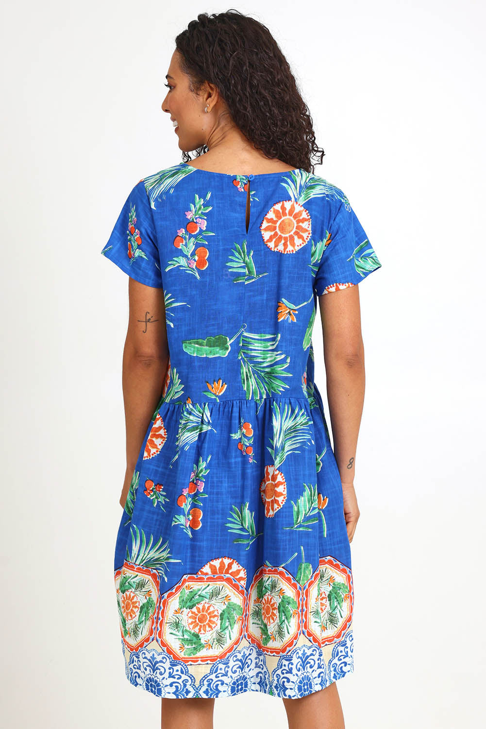 Model Pamelar wearing size 10 of the Boxy Dress – Print in colour Print, from the back