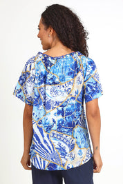 Model Pamelar wearing size 10 of the Frill Neckline Top – Print in colour Print, from an angle