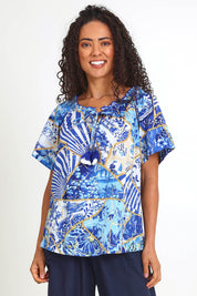 Model Pamelar wearing size 10 of the Frill Neckline Top – Print in colour Print, in a cropped view