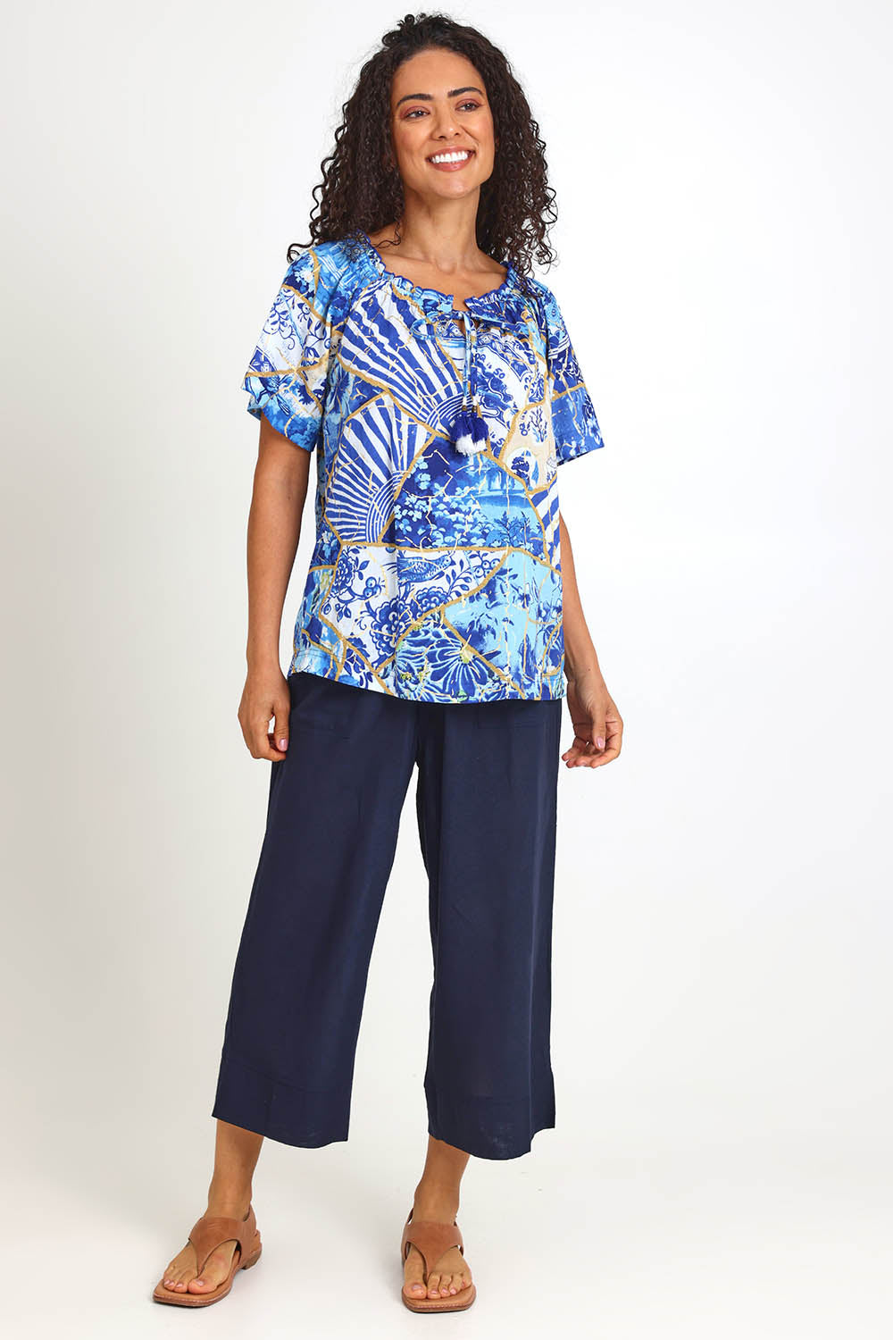 Model Pamelar wearing size 10 of the Frill Neckline Top – Print in colour Print, from the front
