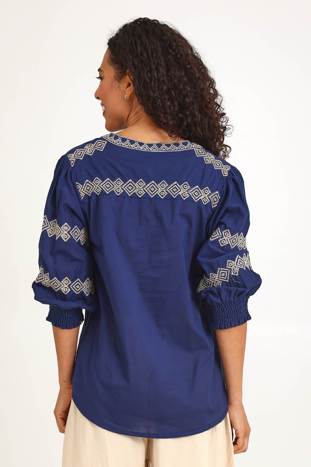 Model Pamelar wearing size 10 of the Essentials Embroidered Cotton Top - Navy in colour Navy, from an angle