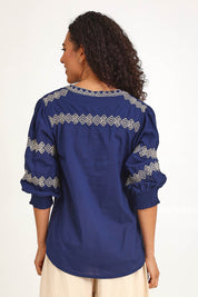 Model Pamelar wearing size 10 of the Essentials Embroidered Cotton Top - Navy in colour Navy, from an angle