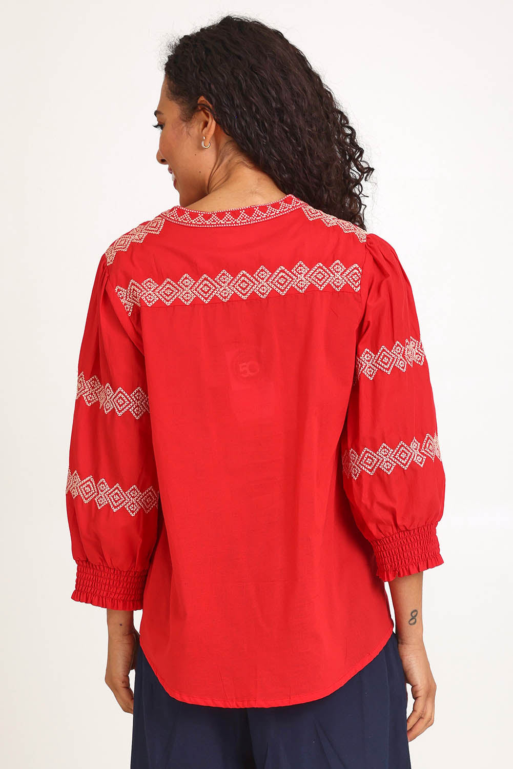 Model Pamelar wearing size 10 of the Essentials Embroidered Cotton Top - Red in colour Red, from the back