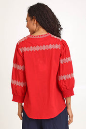 Model Pamelar wearing size 10 of the Essentials Embroidered Cotton Top - Red in colour Red, from the back