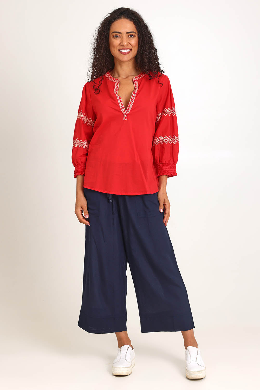 Model Pamelar wearing size 10 of the Essentials Embroidered Cotton Top - Red in colour Red, from the front
