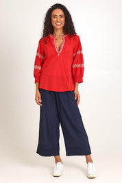 Model Pamelar wearing size 10 of the Essentials Embroidered Cotton Top - Red in colour Red, from the front