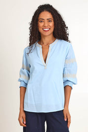 Model Pamelar wearing size 10 of the Essentials Embroidered Cotton Top - Sky in colour Sky, in a cropped view