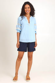 Model Pamelar wearing size 10 of the Essentials Embroidered Cotton Top - Sky in colour Sky, from the front