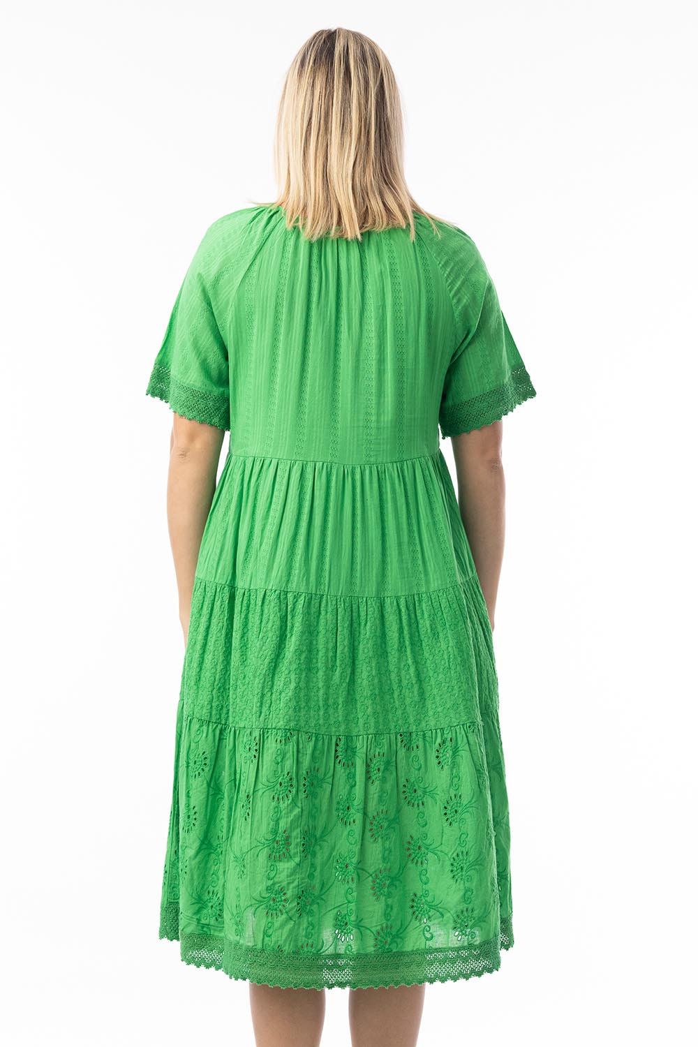 A model wearing the Essential Broderie Layers Cotton Dress in colour Green (Green), from the back
