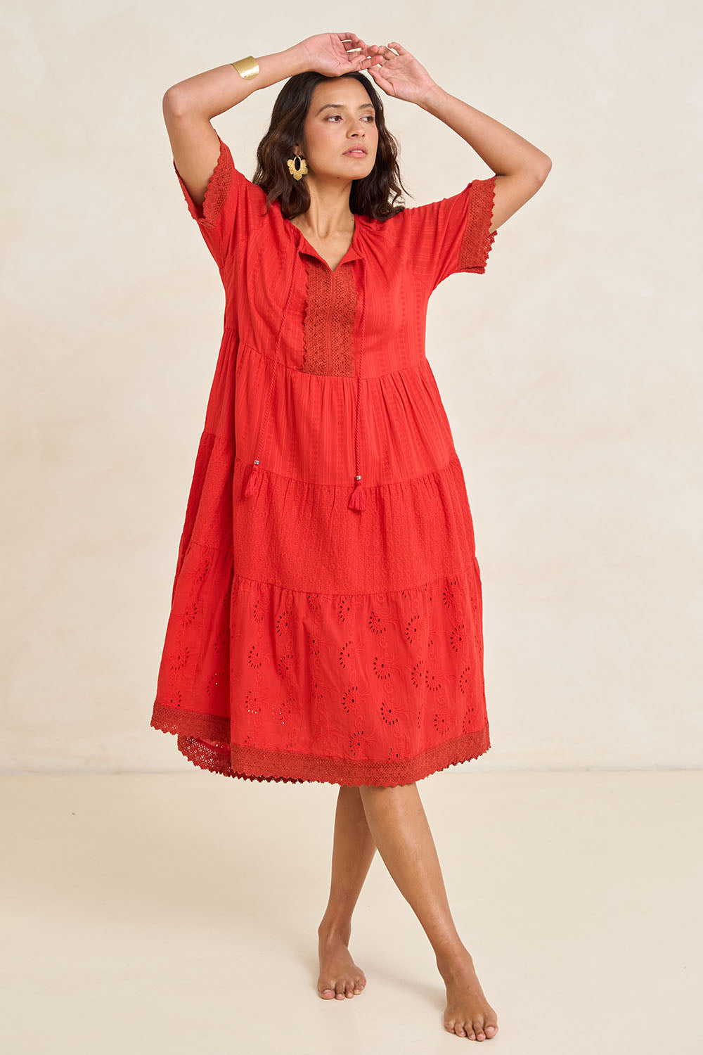 Model Tahnee wearing size 10 of the Essential Broderie Layers Cotton Dress in colour Red (Red), from the front, showing the whole outfit