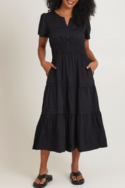 Model Ziara wearing size 10 of the Essentials Organic Cotton Poplin Maxi Ruched Waist Dress in colour Black (Black), from the front, cropped image