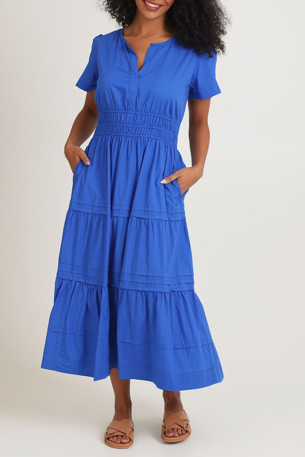 Model Ziara wearing size 10 of the Essentials Organic Cotton Poplin Maxi Ruched Waist Dress in colour Blue (Blue), from the front, cropped image