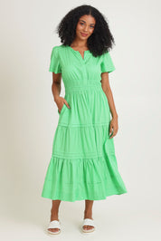 Model Ziara wearing size 10 of the Essentials Organic Cotton Poplin Maxi Ruched Waist Dress in colour Green (Green), from the front, showing the whole outfit