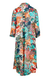 Product shot of the Yakushima Organic Cotton Patch Dress in colour Print (Blue), from the back