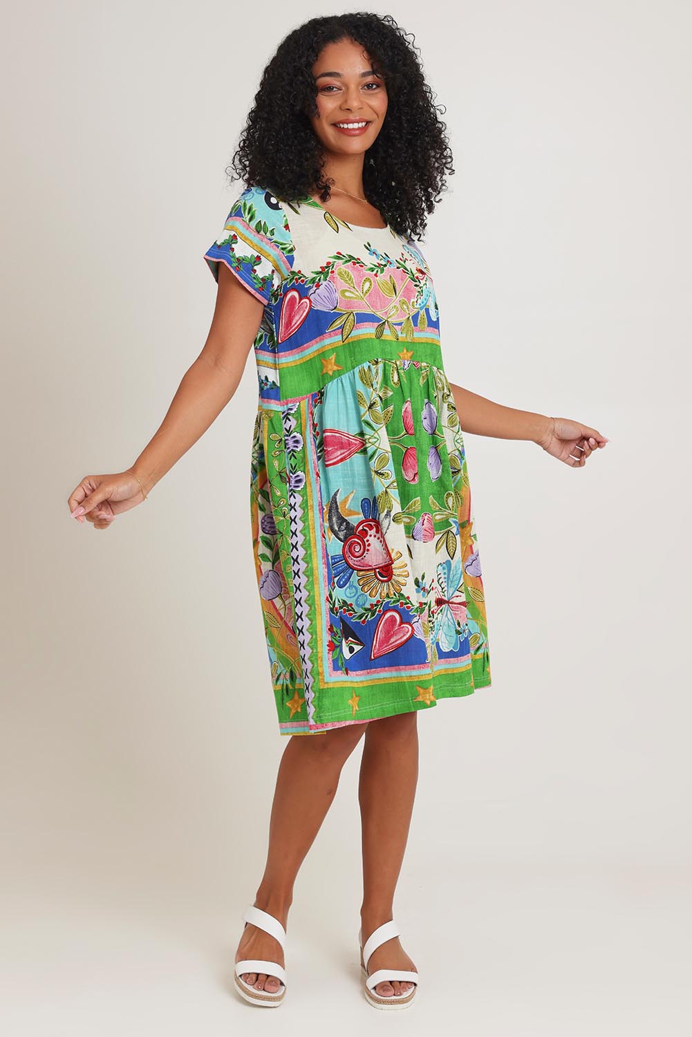 Model Ziara wearing size 10 of the Boxy Cotton Dress in colour Santafe, from the front, showing the whole outfit
