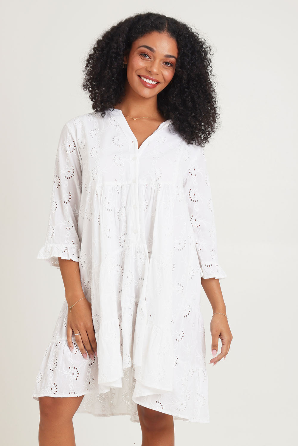 Model Ziara wearing size 10 of the Essentials Frill Hem Broderie Cotton Dress in colour White (White), from the front, cropped image