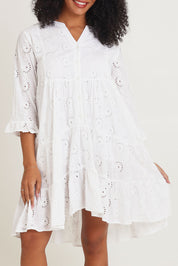 Model Ziara wearing size 10 of the Essentials Frill Hem Broderie Cotton Dress in colour White (White), from the front, cropped image