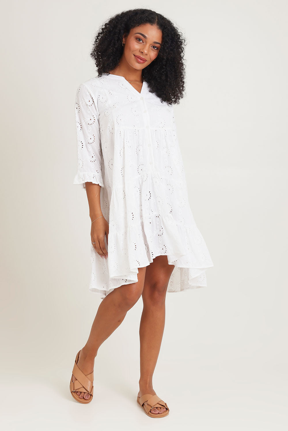 Model Ziara wearing size 10 of the Essentials Frill Hem Broderie Cotton Dress in colour White (White), from the front, showing the whole outfit