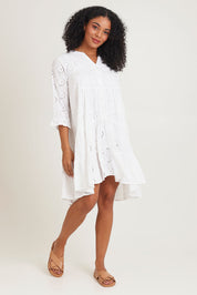 Model Ziara wearing size 10 of the Essentials Frill Hem Broderie Cotton Dress in colour White (White), from the front, showing the whole outfit