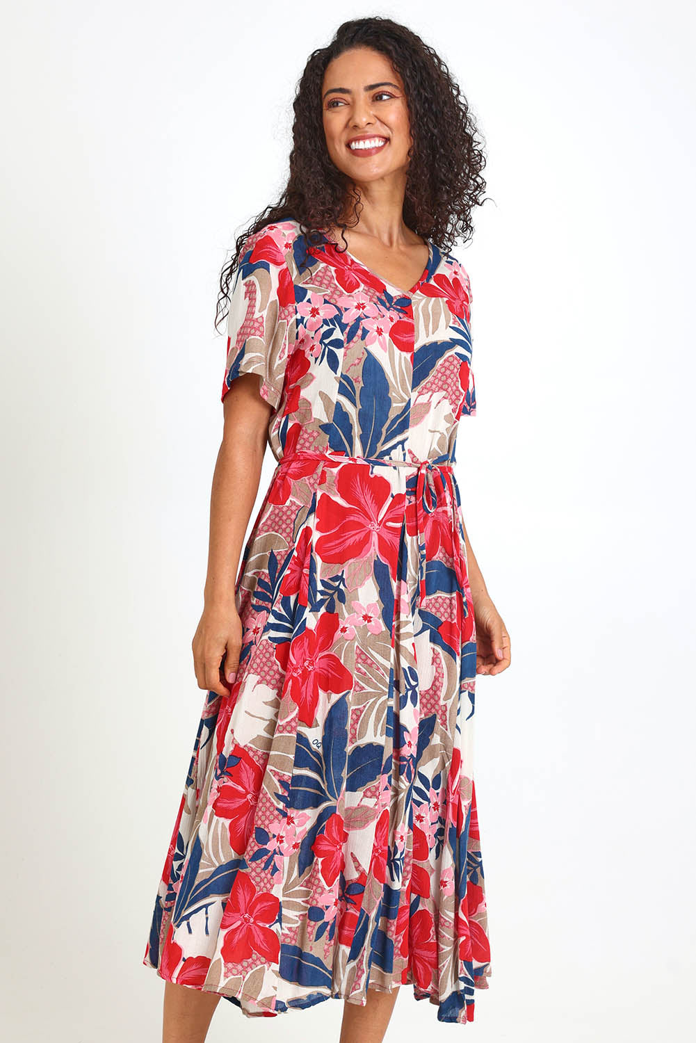 Model Pamelar wearing size 10 of the Godet Dress – Print in colour Print, from an angle
