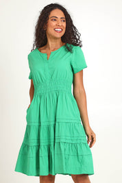 Model Pamelar wearing size 10 of the Essentials Poplin Short Sleeve Cotton Short Dress - Green in colour Green, in a cropped view