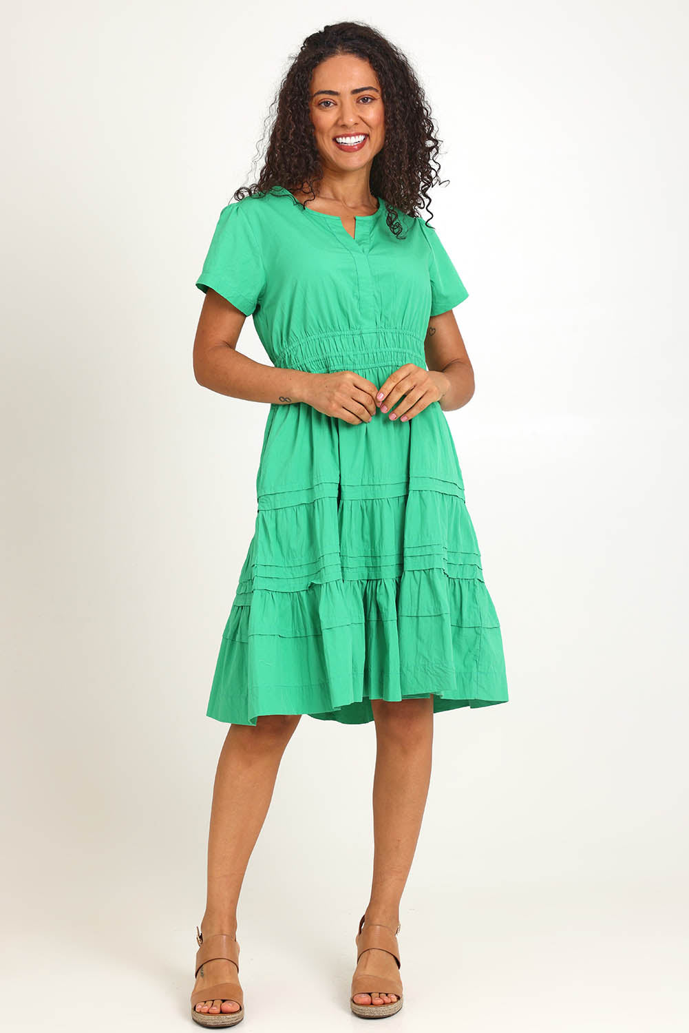 Model Pamelar wearing size 10 of the Essentials Poplin Short Sleeve Cotton Short Dress - Green in colour Green, from the front