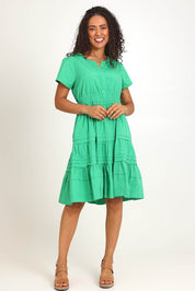 Model Pamelar wearing size 10 of the Essentials Poplin Short Sleeve Cotton Short Dress - Green in colour Green, from the front