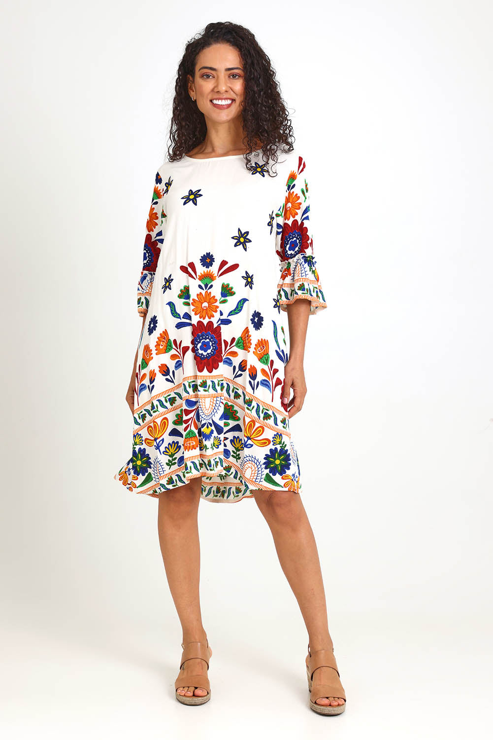 Model Pamelar wearing size 10 of the Contemporary Dress – Print in colour Print, from the front