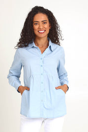 Model Pamelar wearing size 10 of the Essentials Poplin Cotton Shirt - Sky in colour Sky, in a cropped view