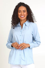 Model Pamelar wearing size 10 of the Essentials Poplin Cotton Shirt - Sky in colour Sky, in a cropped view