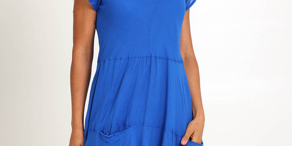 Model Pamelar wearing size 10 of the Essentials Bias Pockets Cotton Dress - Blue in colour Blue, from the front