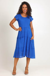 Model Pamelar wearing size 10 of the Essentials Bias Pockets Cotton Dress - Blue in colour Blue, from the front