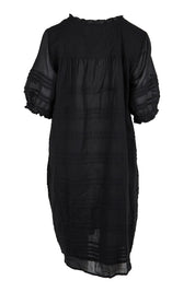 Product shot of the Essentials Pleated Cotton Dress - Black in colour Black, from the back