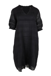 Product shot of the Essentials Pleated Cotton Dress - Black in colour Black, from the front